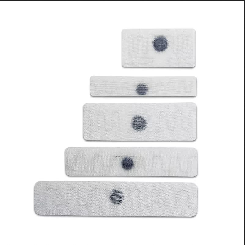 Etiqueta RFID UHF resistente al calor para seguimiento de lavandería de hoteles y hospitales.